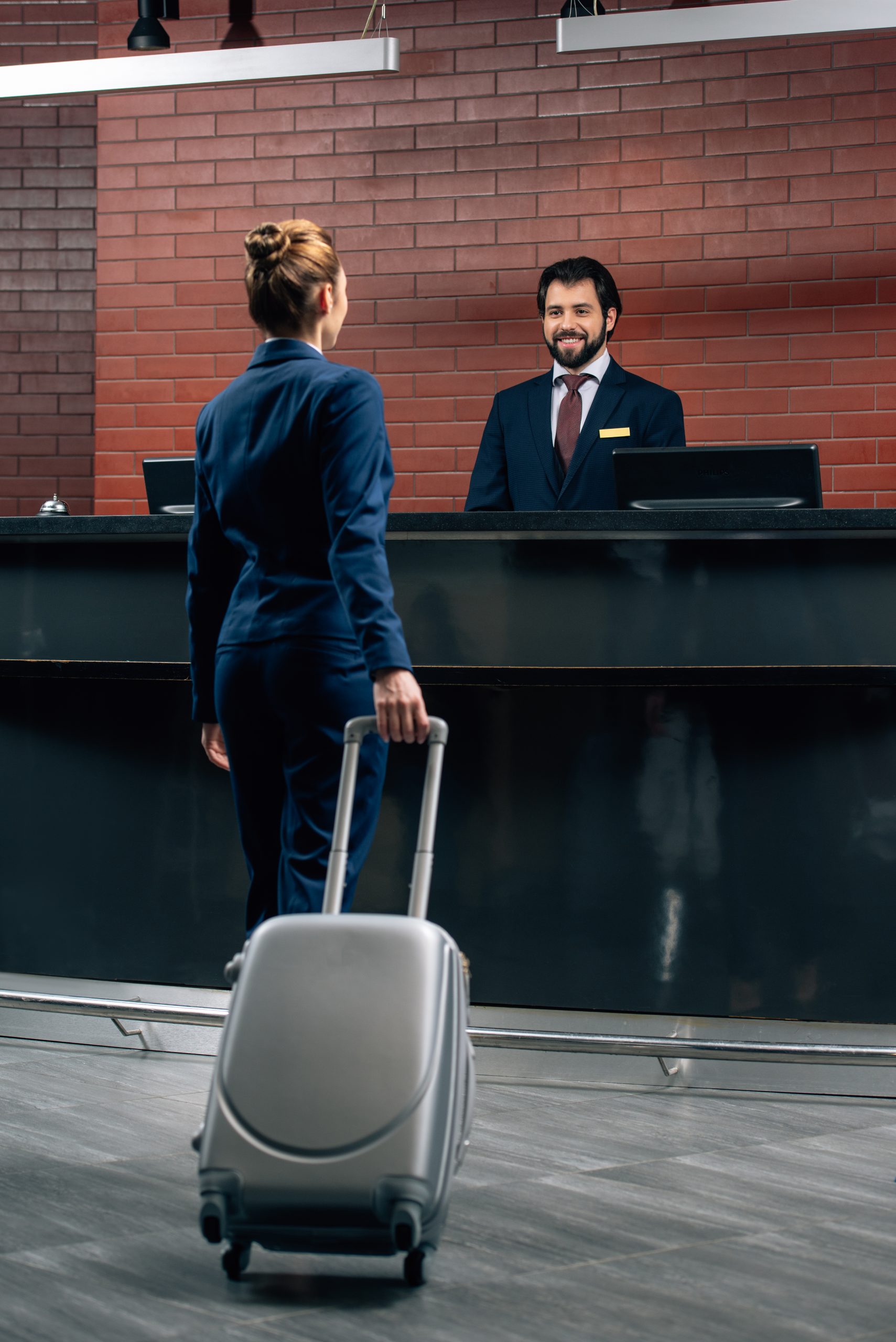 //cheraipalmbeachresort.com/wp-content/uploads/2023/05/businesswoman-with-luggage-going-at-hotel-receptio-scaled.jpg